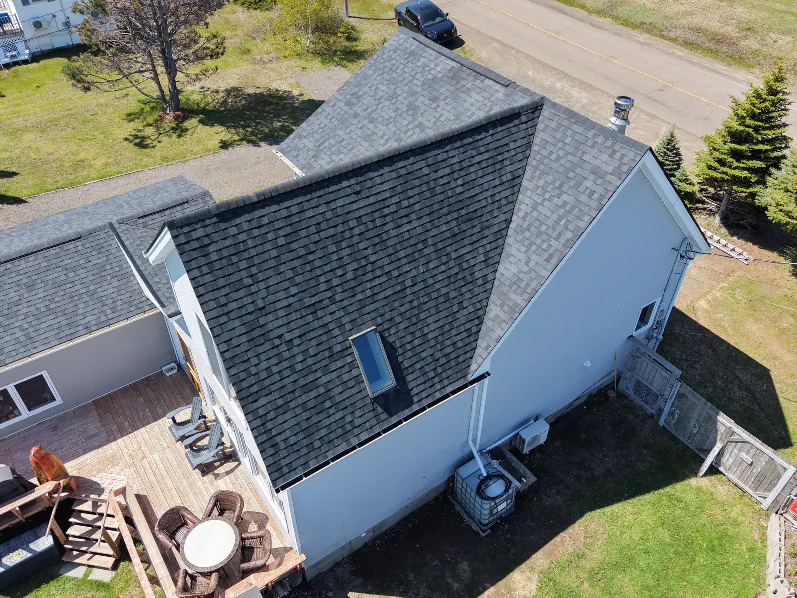this Sackville Victorian finished: new roof, new siding and new gutters in one drone frame