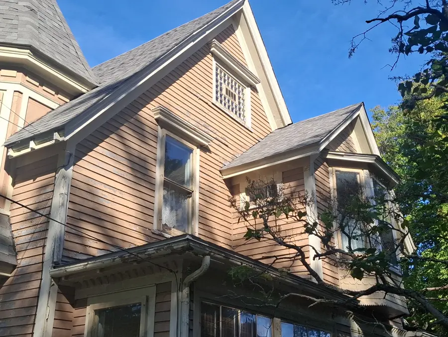 this Sackville Victorian front elevation before: aged tan Victorian with grey scalloped roof