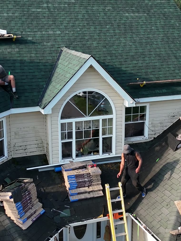 Crew laying new shingles